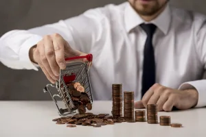 front view businessman spilling shopping cart coins