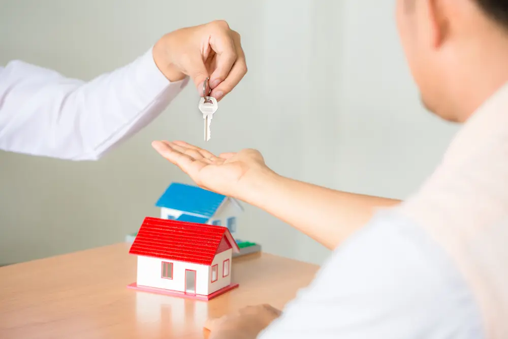 Real Estate Sales Manager Giving Keys Customer